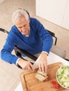 Disabled Senior Man Making Sandwich Royalty Free Stock Photo