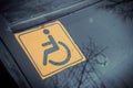 Disabled sign on the car glass. Royalty Free Stock Photo