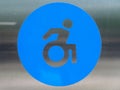 Disabled sign close-up. Information plate of public handicapped toilet. Royalty Free Stock Photo