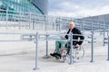 Disabled smiling man in wheelchair on the beginning of the ramp. Royalty Free Stock Photo