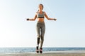 Disabled sports woman jumping with skipping rope Royalty Free Stock Photo