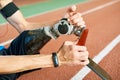 Disabled Sportsman Fixing Artificial Limb