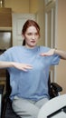 A disabled sporty woman is showing a sporty exercise on a video