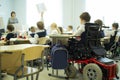 A disabled student in a wheelchair in primary school