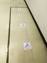 Disabled sticker symbal stick on ceramic floor for wheel chair in hospital. handicap reserve space zone. four wheelchair sign no p