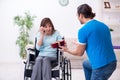 Disabled wife and young husband at home Royalty Free Stock Photo