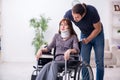 Disabled wife and young husband at home Royalty Free Stock Photo