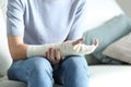 Disabled woman grabbing her painful bandaged arm Royalty Free Stock Photo