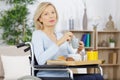 Disabled woman having breakfast Royalty Free Stock Photo