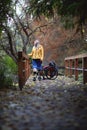 Disabled woman without legs walking in the park