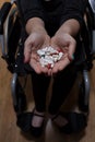 Disabled woman with medicines for depression