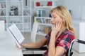 Disabled woman reading novel Royalty Free Stock Photo