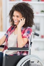 Disabled woman on wheelchair using mobil phone Royalty Free Stock Photo