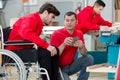 disabled worker in wheelchair in carpenters workshop Royalty Free Stock Photo