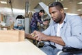 disabled worker in wheelchair in carpenters workshop Royalty Free Stock Photo