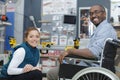 disabled worker in wheelchair in carpenters workshop Royalty Free Stock Photo