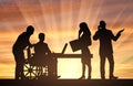 Disabled working. Silhouette of a disabled man in a wheelchair and his work team Royalty Free Stock Photo