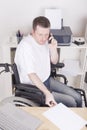 Disabled young man at the office Royalty Free Stock Photo