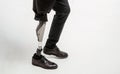 Disabled young man with prosthetic leg, artificial limb concept Royalty Free Stock Photo