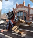 Disabled young man in a wheelchair falls down some stairs Royalty Free Stock Photo