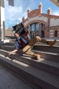 Disabled young man in a wheelchair falls down some stairs Royalty Free Stock Photo