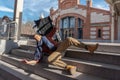 Disabled young man in a wheelchair falls down some stairs Royalty Free Stock Photo