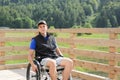 Disabled young man on a wheelchair