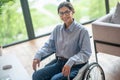 A disabled young woman looking contented and smiling nicely Royalty Free Stock Photo