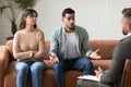 Couple talking at therapy session with male therapist Royalty Free Stock Photo