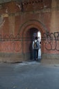 Man disappears through archway tunnel Royalty Free Stock Photo