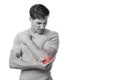 Disappoint young european man suffering from elbow pain, presses hand to sore spot, with red, monochrome