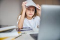 Disappointed adolescent putting some files above her head Royalty Free Stock Photo