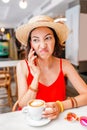 asian woman using mobile phone during breakfast in coffee shop Royalty Free Stock Photo