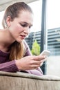 Disappointed beautiful young woman having problems in reading text messages