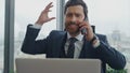 Disappointed boss yelling phone in office desk close up. Business man shouting. Royalty Free Stock Photo