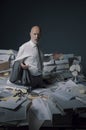 Disappointed business executive standing in his messy office Royalty Free Stock Photo