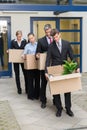 Disappointed Businesspeople With Cardboard Boxes