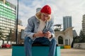 Disappointed Caucasian millennial guy reading text message on mobile phone with upset facial expression Royalty Free Stock Photo