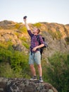 A man trying to call a phone on a natural background. Tourist can`t call a phone. Bad connection concept. Copy space. Royalty Free Stock Photo