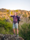 A man trying to call a phone on a natural background. Tourist can`t call a phone. Bad connection concept. Copy space. Royalty Free Stock Photo