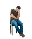 Disappointed man sitting on a chair Royalty Free Stock Photo