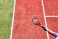 Disappointed mature man lying while holding tennis racket on court during summer Royalty Free Stock Photo