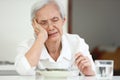 Disappointed old elderly people eating overnight food,she`s sick of food,tired of eating same food,lacking flavor,Asian senior