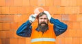 Disappointed Sad Caucasian Contractor Worker Facing. Legal Problems. Bond, Insurance, Work Injury Concept Photo. Bearded