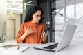 Disappointed and sad woman looking at phone screen, reading bad news online, Hispanic business woman working inside Royalty Free Stock Photo