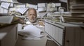 Disappointed stressed businessman overwhelmed by paperwork Royalty Free Stock Photo