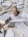 Disappointed stressed businessman overwhelmed by paperwork Royalty Free Stock Photo