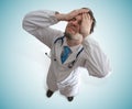 Disappointed and stressed doctor. Failure and malpractice concept Royalty Free Stock Photo