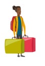 Disappointed tourist holding two big suitcases. Royalty Free Stock Photo