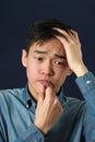 Disappointed young Asian man Royalty Free Stock Photo